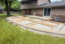 Secondary preparation of exposed aggregate border for decorative concrete patio