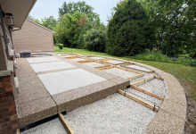 Secondary preparation of exposed aggregate border for decorative concrete patio